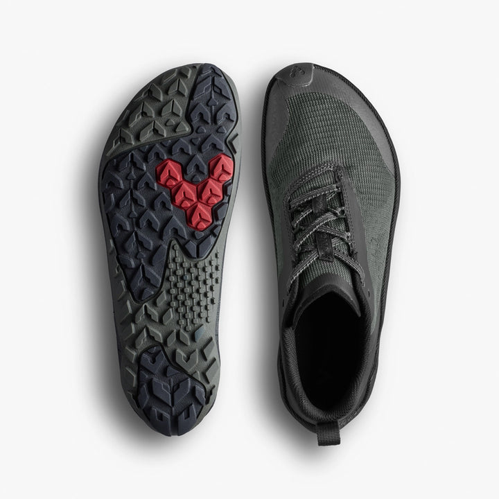 The VIVOBAREFOOT Primus Trail Flow (Women's) are lightweight dark green athletic shoes with an all-terrain outsole, textured black pattern, and a red heart-shaped design at the center, shown from above and below.