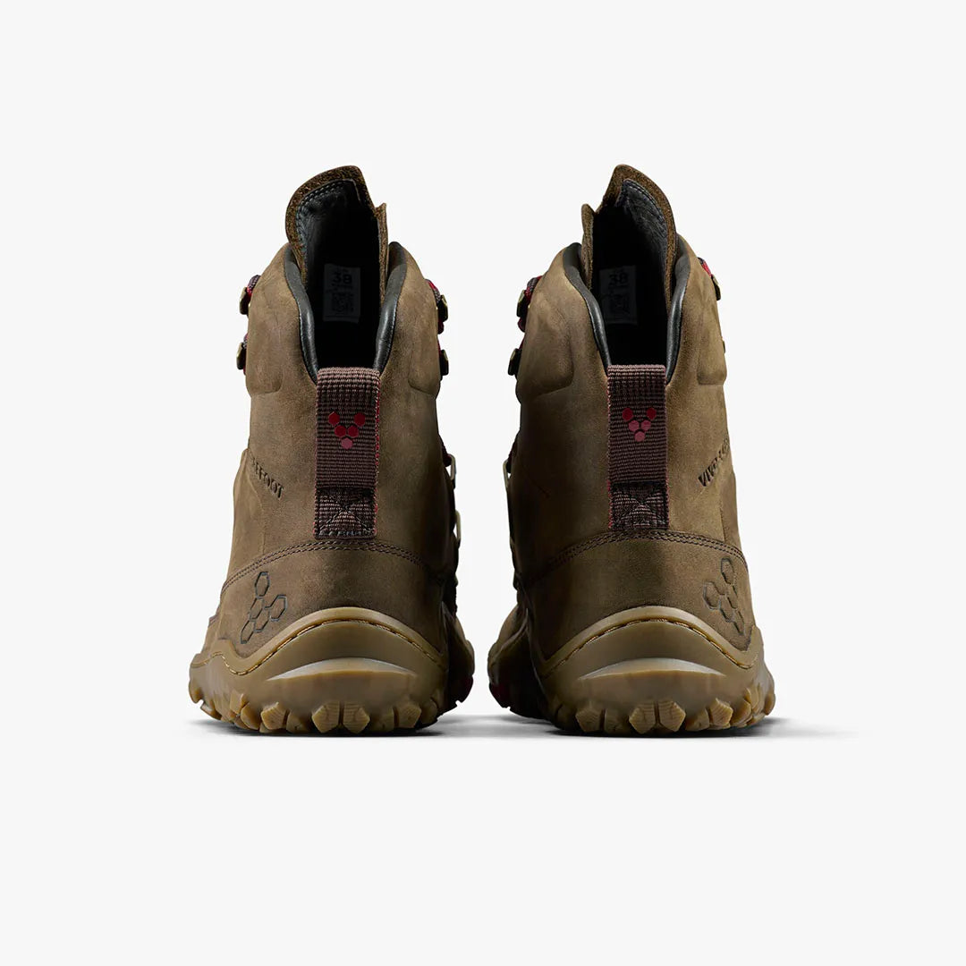 The VIVOBAREFOOT Tracker Leather AT II (Women's) boots are shown from the back on a light background, displaying red-logo pull tabs, rugged all-terrain soles, and visible stitching, positioned side by side.