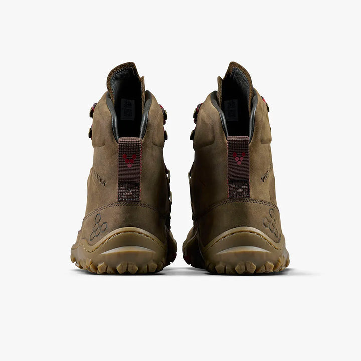 The VIVOBAREFOOT Tracker Leather AT II (Women's) boots are shown from the back on a light background, displaying red-logo pull tabs, rugged all-terrain soles, and visible stitching, positioned side by side.