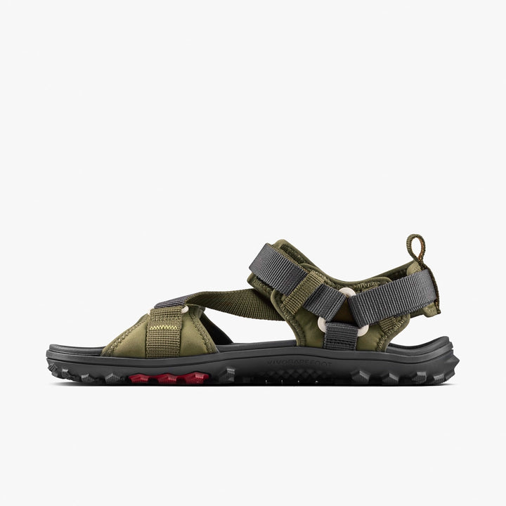 The VIVOBAREFOOT Tracker Ora Sandal (Women's) features olive green straps, grey adjustable buckles, and a black textured sole with red tread accents, shown against a plain white background.