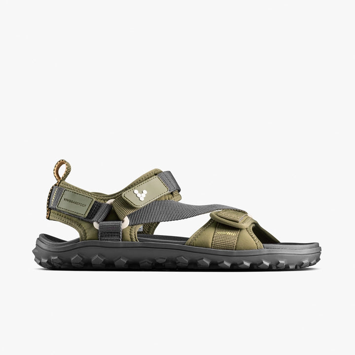 Side view of the VIVOBAREFOOT Tracker Ora Sandal (Women's) in olive green and gray, featuring adjustable straps, a rugged black sole, neoprene upper, and heel pull tab—ideal for hiking and outdoor adventures.