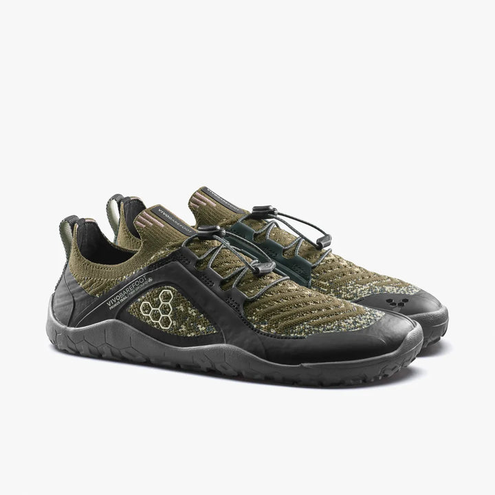 A pair of olive green Vivobarefoot Primus Trail Knit FG Grounding (Men’s) barefoot trail shoes with black trim and toggle lacing.