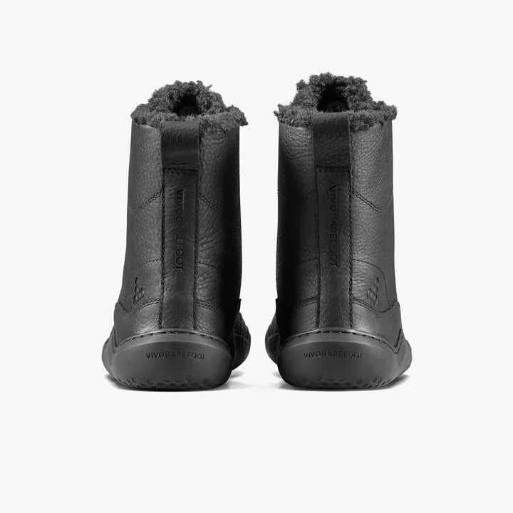 Back view of two black Gobi Boot II Warmlined (Men’s) leather winter boots with fur-lined collars and flat, flexible soles.