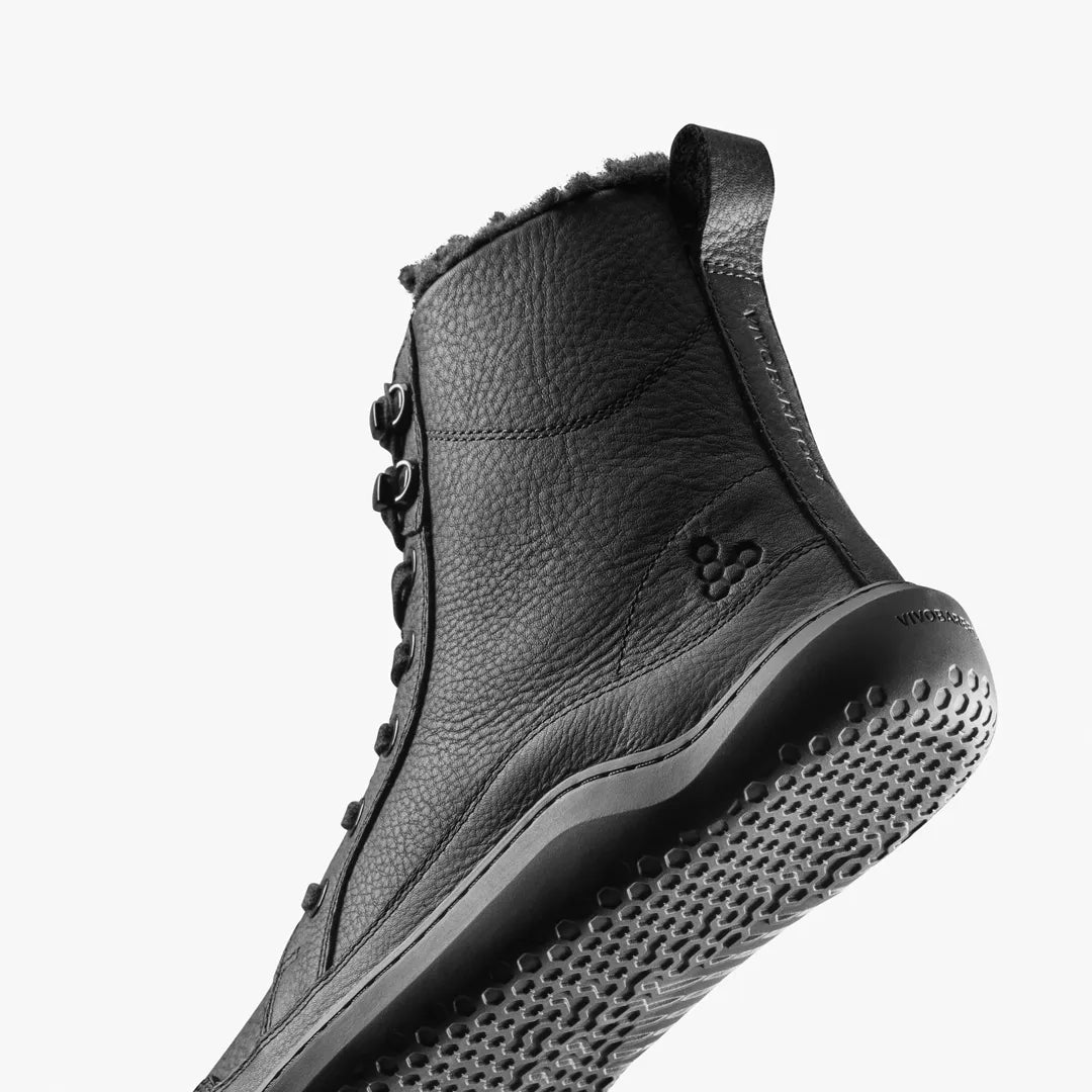 Black leather Gobi Boot II Warmlined (Men’s) lace-up winter boots featuring a warm faux-fur lining and a textured rubber sole.