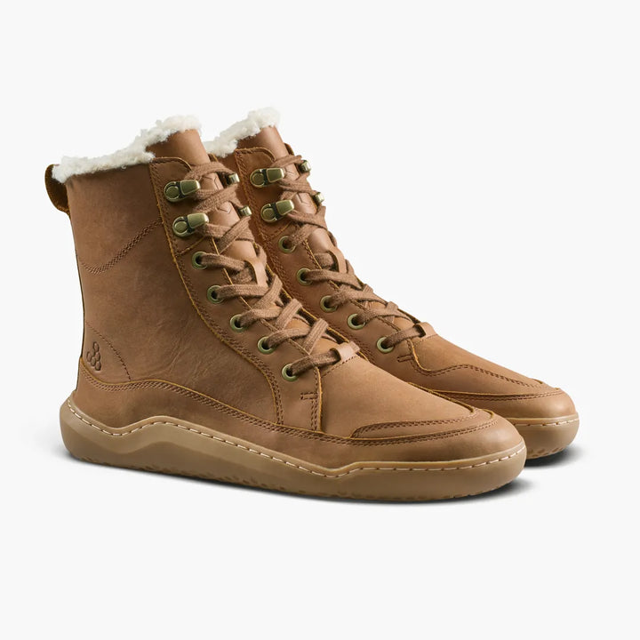 VIVOBAREFOOT Gobi Boot II Warmlined (Men’s) tan leather lace-up winter boots featuring a white faux-fur lining and a flat rubber sole.