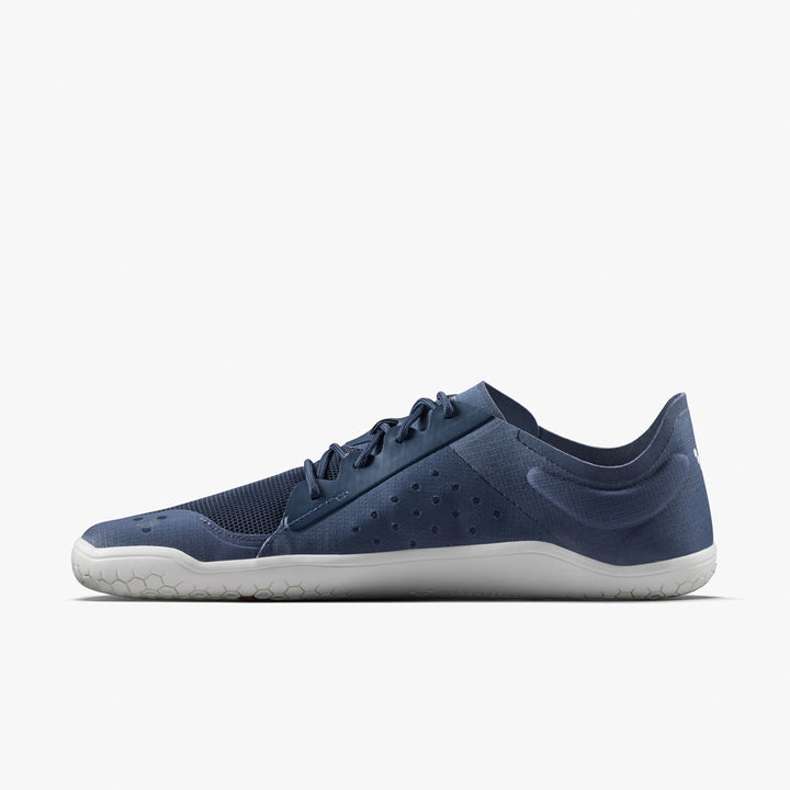 The VIVOBAREFOOT Primus Lite IV (Men's) is a minimalist navy performance trainer with a mesh and synthetic upper, subtle perforations, navy laces, and a thin white sole, shown in side profile on a plain white background.