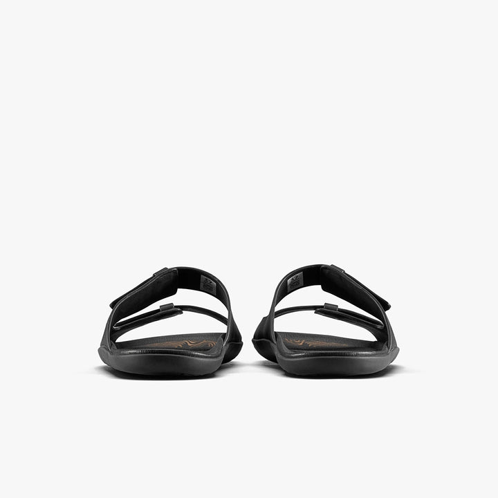 A pair of VIVOBAREFOOT Sensus Yin Slide (Men's) sandals in black are shown from the back with adjustable straps and a flat Earthfoam sole, set against a plain white background.