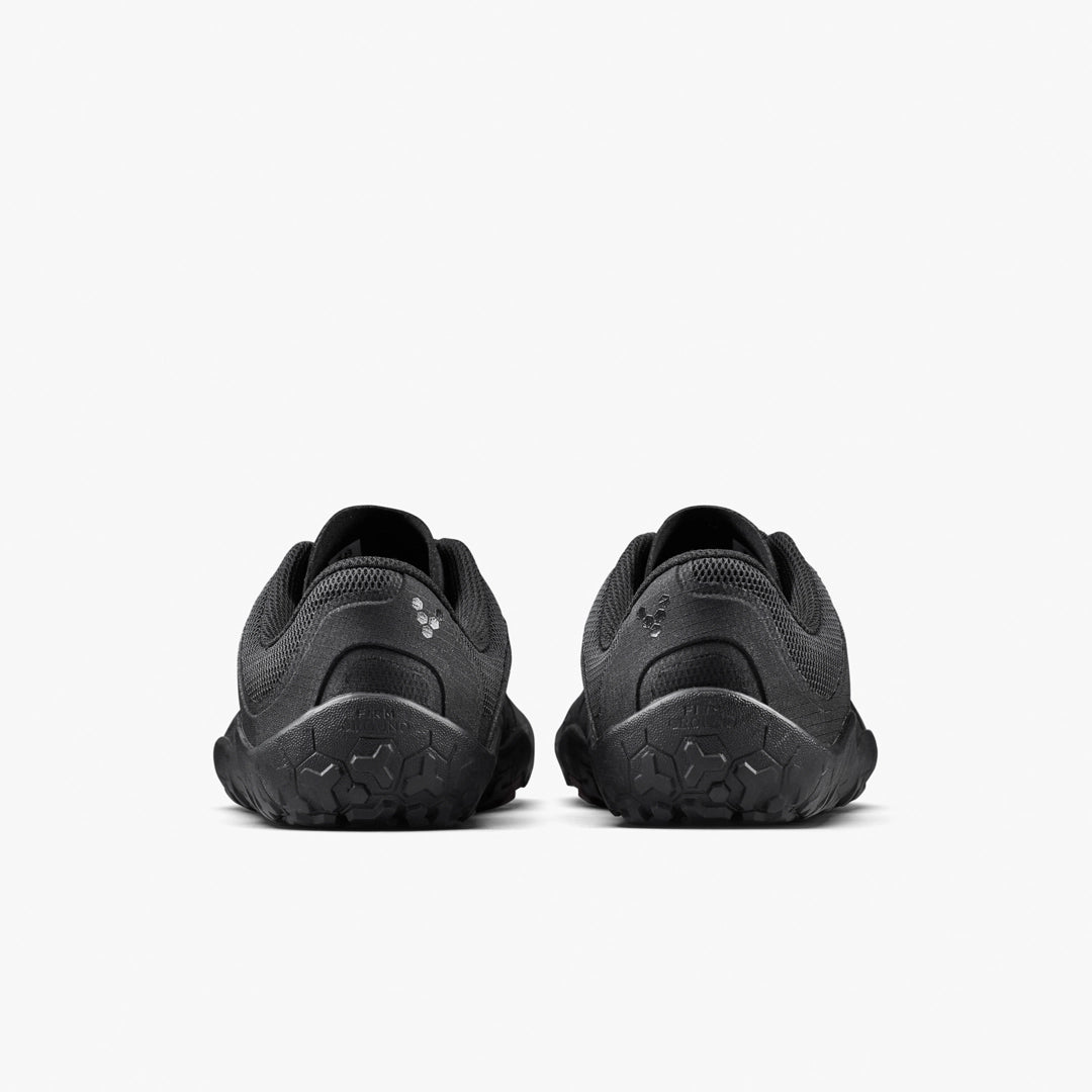 The VIVOBAREFOOT Primus Trail FG 3.5 (Men’s) trainers are shown from the back against a white background, featuring textured soles, breathable mesh uppers, and subtle logo details near the heels.