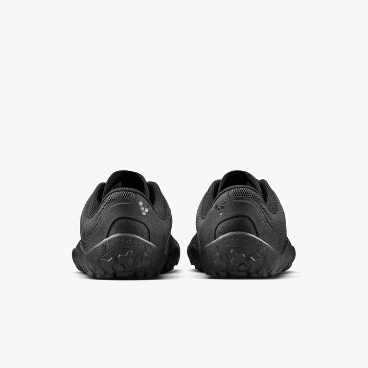 The VIVOBAREFOOT Primus Trail FG 3.5 (Men’s) trainers are shown from the back against a white background, featuring textured soles, breathable mesh uppers, and subtle logo details near the heels.