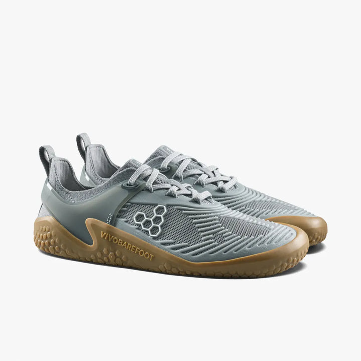 A pair of gray Motus Strength II (Men’s) athletic shoes in breathable mesh with gum-colored soles.