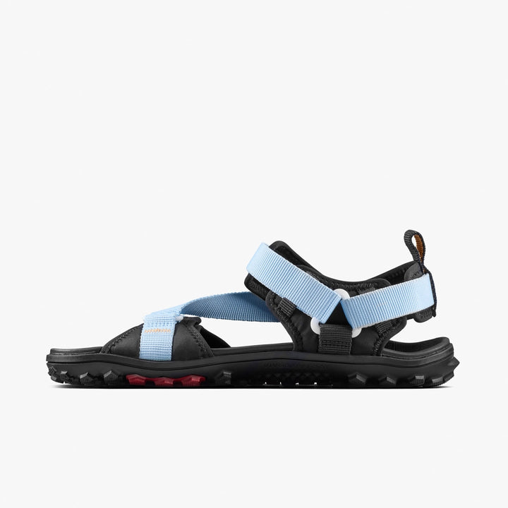The VIVOBAREFOOT Tracker Ora Sandal (Men's) is shown in side profile against a white background, featuring an all-terrain rugged black sole and light blue adjustable straps for outdoor barefoot comfort.