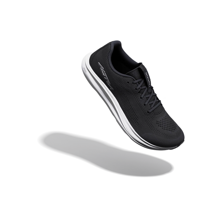 A black ALTRA Escalante 5 (Men’s) running shoe with white accents is displayed suspended mid-air above a subtle shadow against a plain white background, highlighting its distinctive FootShape™ Fit and zero drop design.