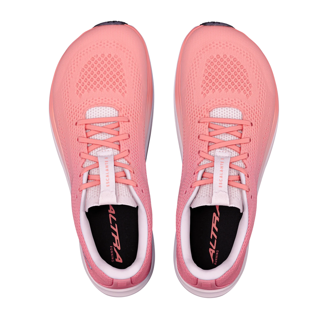 A pair of ALTRA Escalante 5 (Women’s) pink running shoes with a FootShape Fit design, white soles, and black insoles, viewed from above on a plain white background.