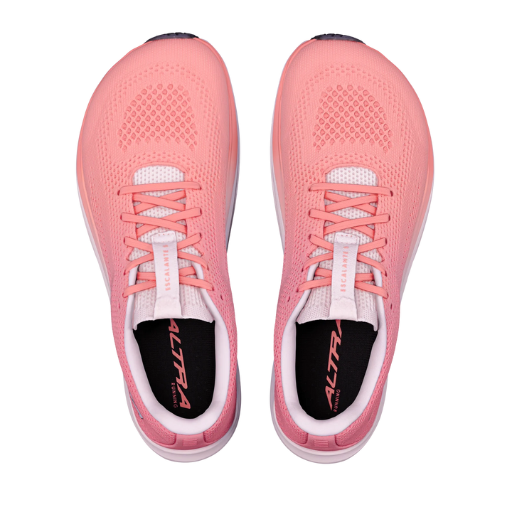 A pair of ALTRA Escalante 5 (Women’s) pink running shoes with a FootShape Fit design, white soles, and black insoles, viewed from above on a plain white background.