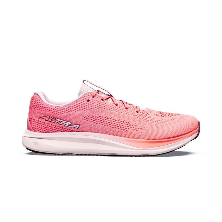 The ALTRA Escalante 5 (Women’s) is a pink athletic running shoe that features a white sole, breathable mesh upper, and laces. Highlighted by ALTRA branding on the side, this shoe offers a lightweight, airy design with FootShape Fit for natural toe splay and enhanced comfort. The Altra EGO midsole provides responsive cushioning and reliable support—all presented against a plain white background.