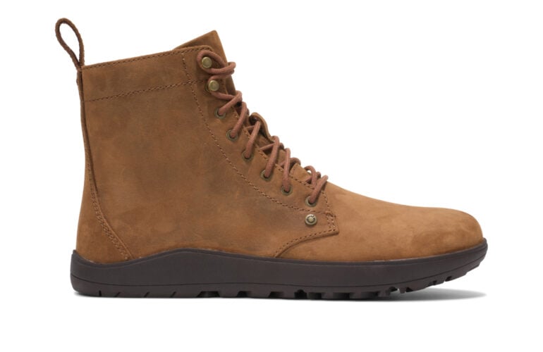 The Breckenridge (Women's) is a brown lace-up ankle boot with a flat black rubber sole and suede finish, displayed from the side on a white background.