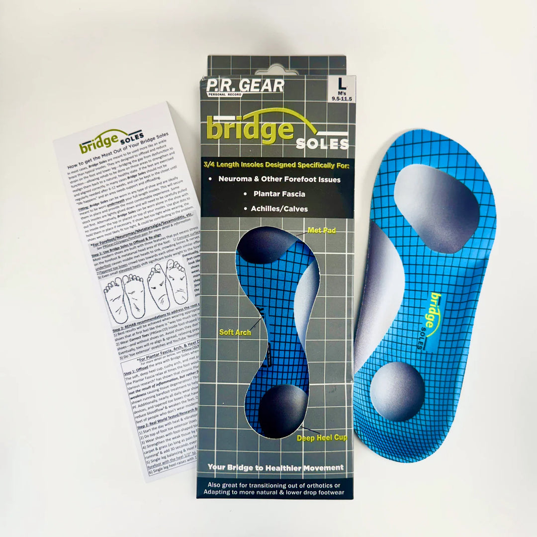 A package of Bridge Soles insoles from Bridge Soles is displayed, featuring one blue insole with a grid pattern and targeted padding for forefoot and arch support, alongside an informational pamphlet.