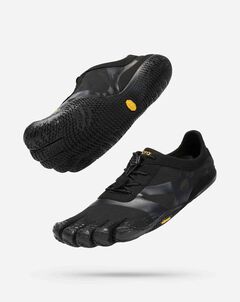 The Vibram KSO Evo (Men's) are black minimalist running shoes with individual toe slots and textured soles for functional fitness, shown floating against a white background.