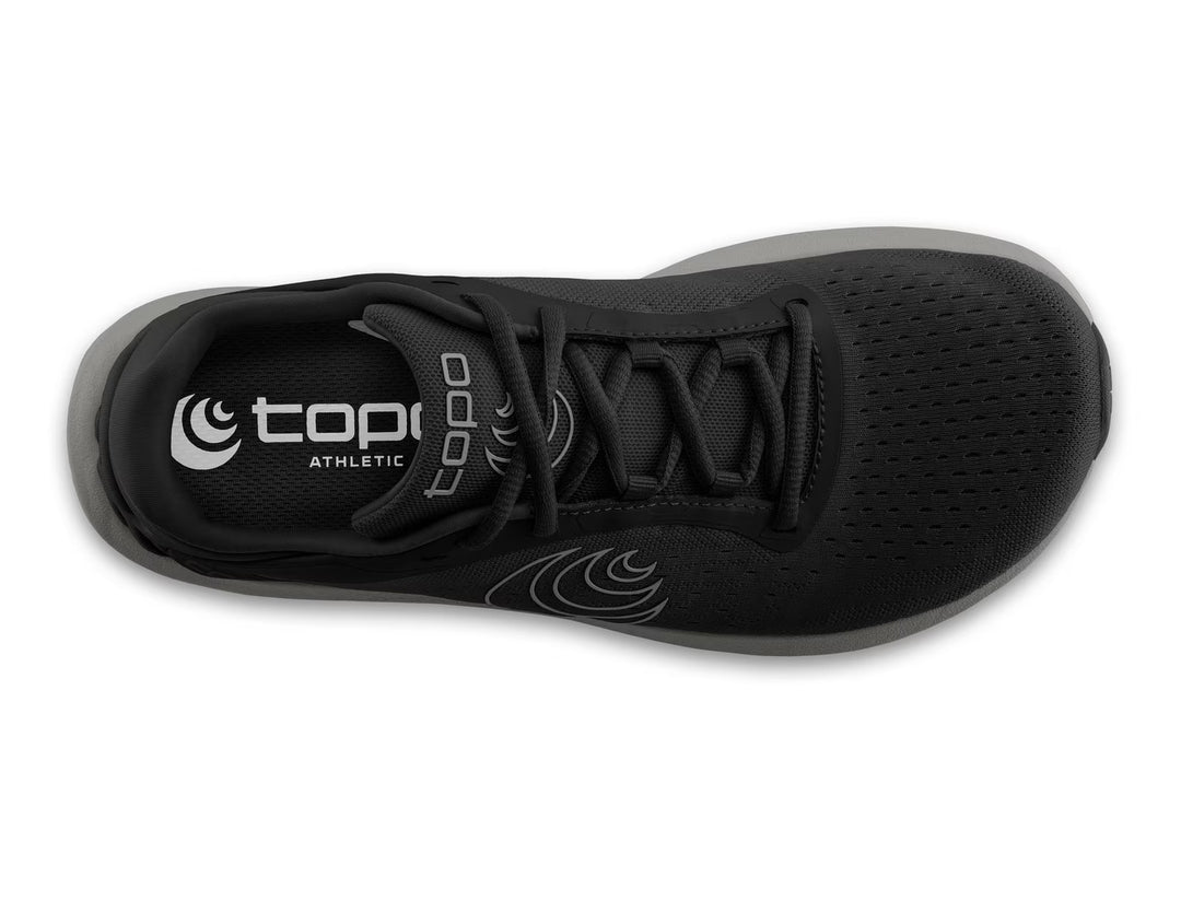 Top view of the TOPO ST-6 (Men's) black athletic shoe with black laces, white topo logo on the insole, subtle wave design, zero drop platform, breathable mesh upper, and a roomy toe box for natural movement.
