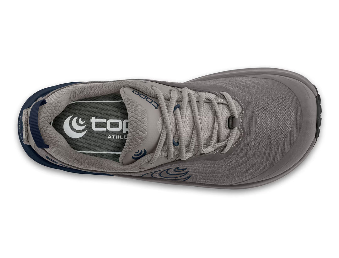 A top view of the TOPO Pursuit 3 (Men’s) gray trail runner athletic shoe with laces, featuring a dark gray insole with the topo ATHLETIC logo in white and blue accents on the heel. Designed for performance, this shoe is equipped with Vibram Megagrip technology to provide superior traction on varied terrain.
