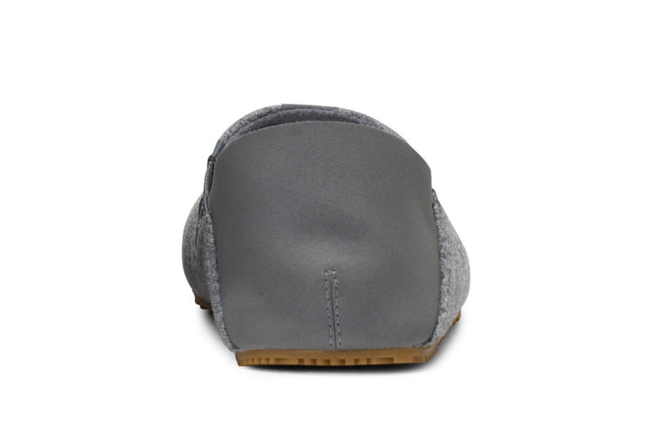 The Pagosa (Men's) gray slipper shoe is shown from the back, highlighting its soft fabric heel and brown rubber sole.