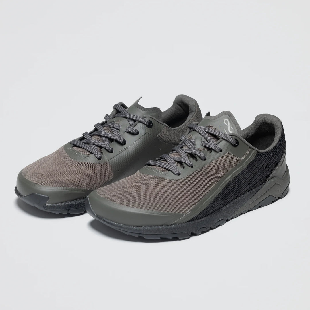 A pair of Notace Yama T1 men's trail shoes in dark gray with black laces and textured soles for all-day comfort, shown side by side on a plain light background.