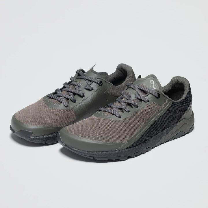 A pair of Notace Yama T1 men's trail shoes in dark gray with black laces and textured soles for all-day comfort, shown side by side on a plain light background.