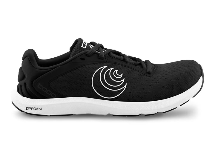 The TOPO ST-6 (Women's) is a black athletic running shoe with a white curved side logo, thick white ZIPFOAM sole, zero drop, roomy toe box, black laces, and a low-profile design for natural movement.
