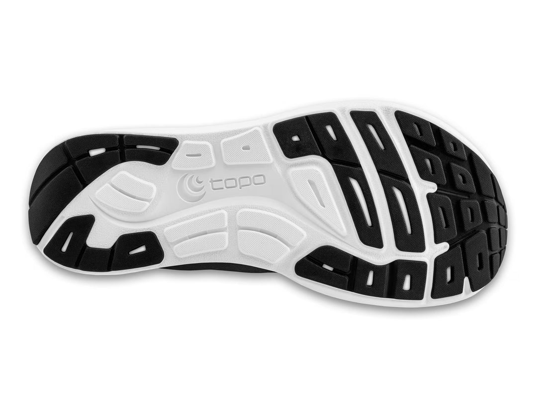 The image shows the sole of the TOPO ST-6 (Women's) shoe, with a white base, black rubber grip sections, textured tread patterns, and "topo" embossed in the center—designed for zero drop barefoot running.