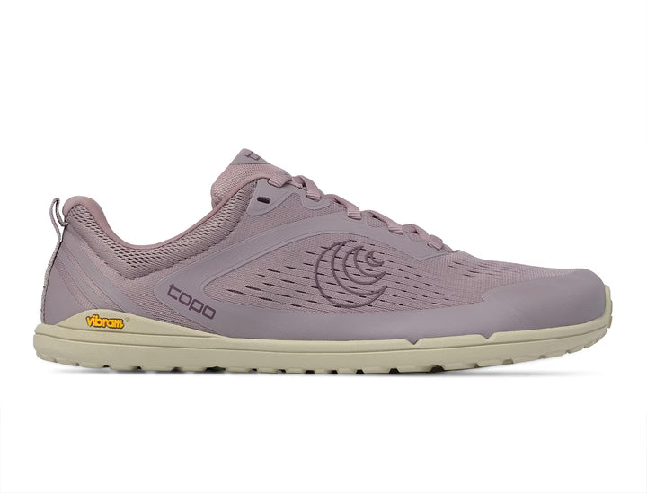 A light purple minimalist shoe, the TOPO Connect (Women’s), features a beige sole, mesh upper, and logo details. It showcases TOPO branding on the side and Vibram branding on the heel, along with a durable Vibram outsole for enhanced traction.