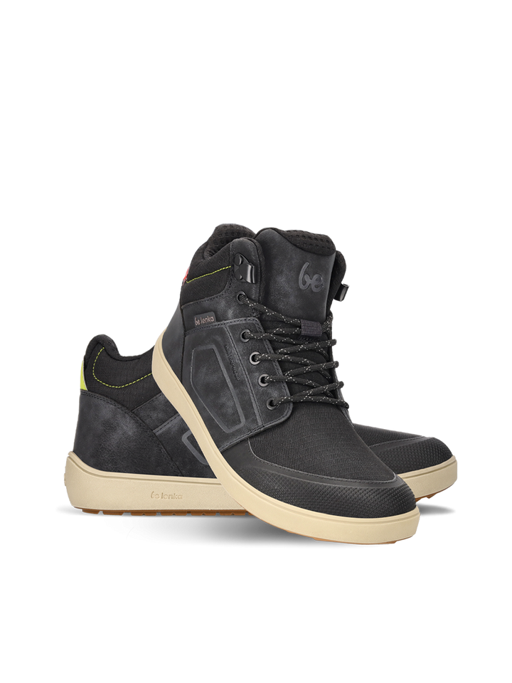 The BeLenka ArcticEdge (Unisex) features black high-top sneakers with beige ThermoGrip Neo soles, black laces, and subtle yellow heel accents, shown against a plain white background.