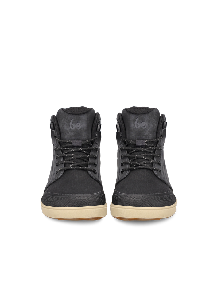 A pair of BeLenka ArcticEdge (Unisex) black high-top sneakers with tan ThermoGrip Neo soles, black laces, and Go branding on the tongue, displayed facing forward on a plain white background.