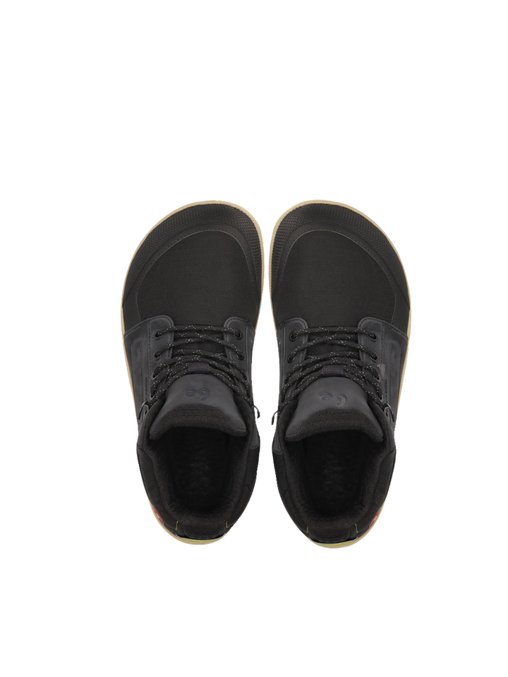 A pair of BeLenka ArcticEdge (Unisex) black high-top sneakers, shown from above with black laces and dark ThermoGrip Neo soles, are placed side by side on a plain white background.