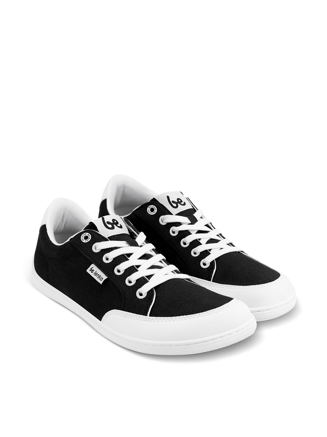 The BeLenka Rebound (Unisex) sneakers are black and white with white laces and soles, a small branded tag on the side, and a logo on the tongue. They are comfortable and shown on a plain white background.