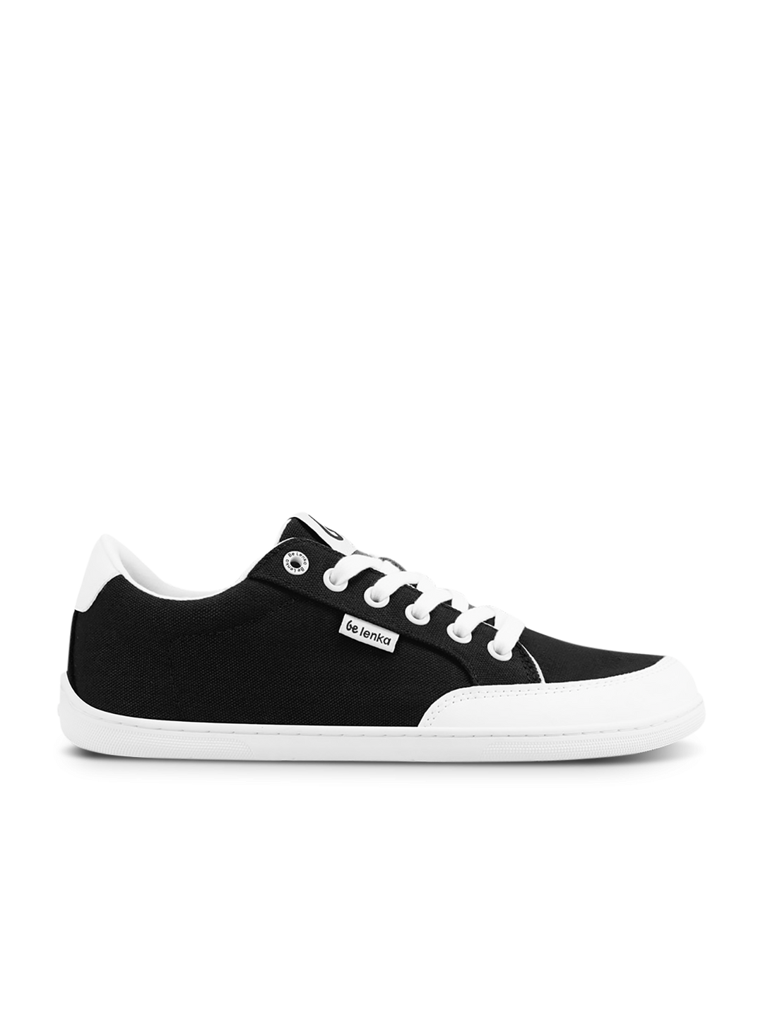 The BeLenka Rebound (Unisex) is a black and white low-top retro sneaker featuring white laces, a white sole, toe cap, and side label. Displayed on a plain white background, these comfy sneakers are ideal for everyday wear.