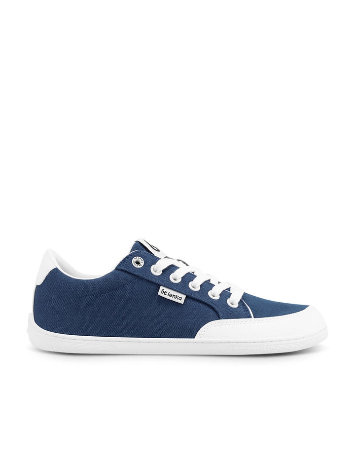 The BeLenka Rebound (Unisex) is a blue canvas retro sneaker with white laces, a white rubber sole, and a small rectangular BeLenka label on the side. These comfy sneakers are shown against a plain white background.