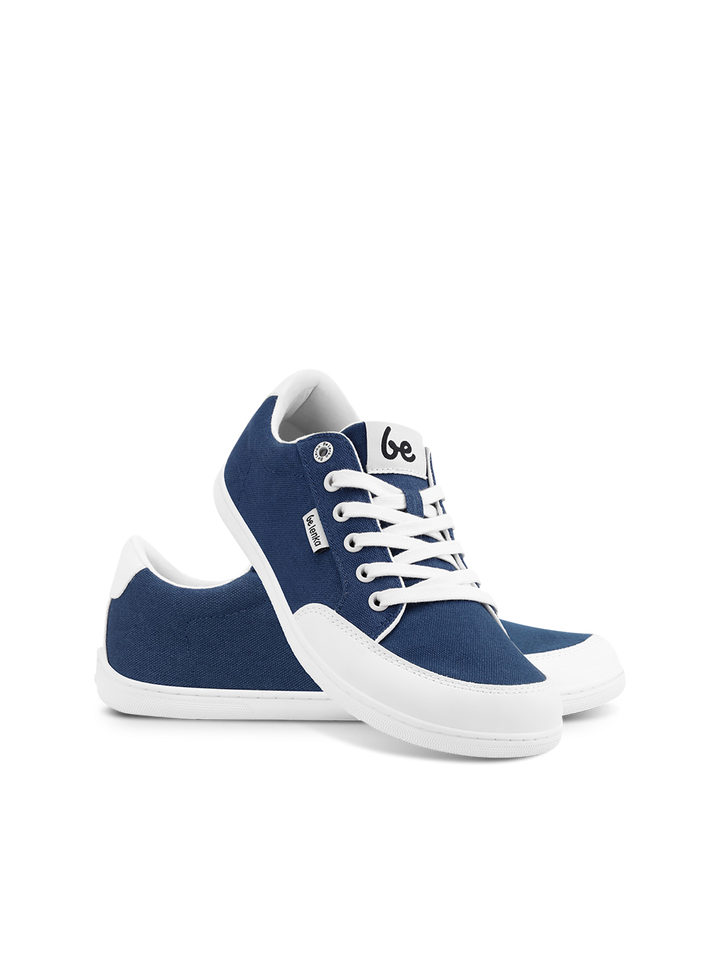 The BeLenka Rebound (Unisex) sneakers in blue and white feature white laces and rubber soles. One lightweight sneaker stands upright, the other leans against it, both displayed on a plain white background.