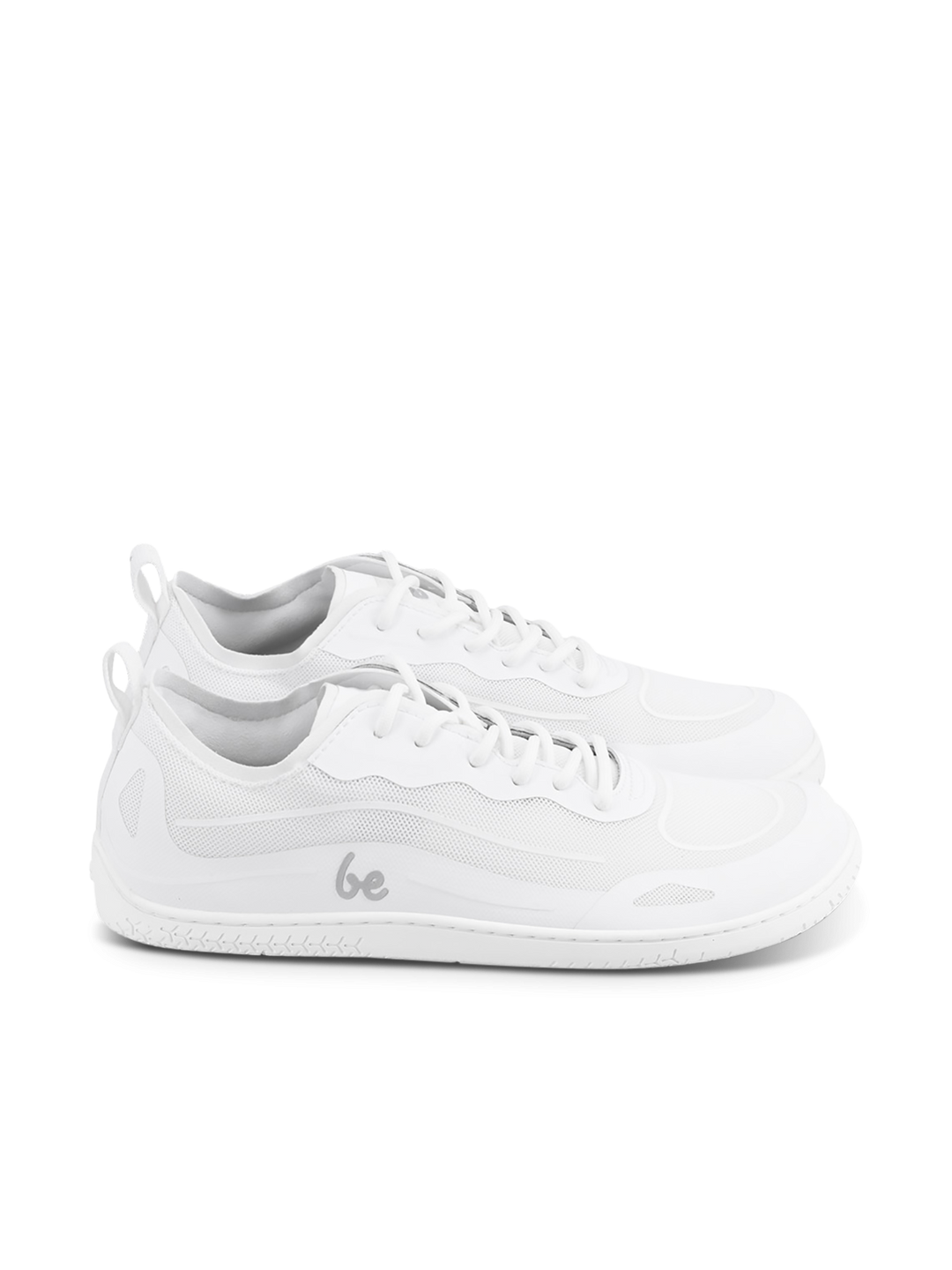 A pair of BeLenka Velocity unisex white low-top sneakers featuring mesh and synthetic material details, white laces, a flexible sole, and the word "be" printed in gray on the side.