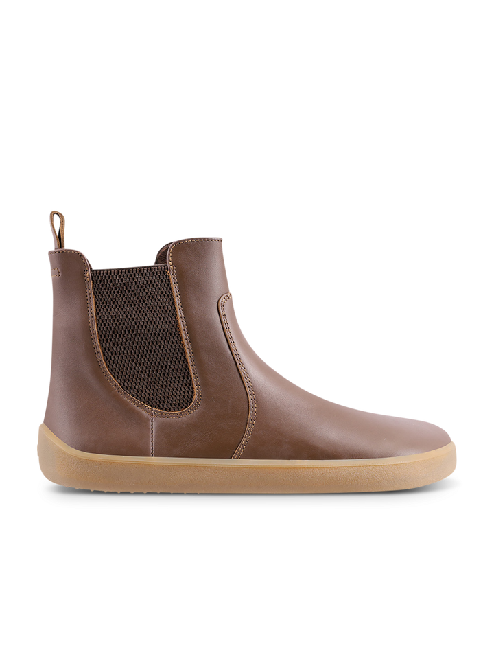 The BeLenka Entice Neo (Unisex) is a brown Chelsea boot with elastic side panels, a back loop, and a light tan rubber sole. Designed with a wide toe box for enhanced comfort, the boot is displayed in profile, facing right, against a white background.