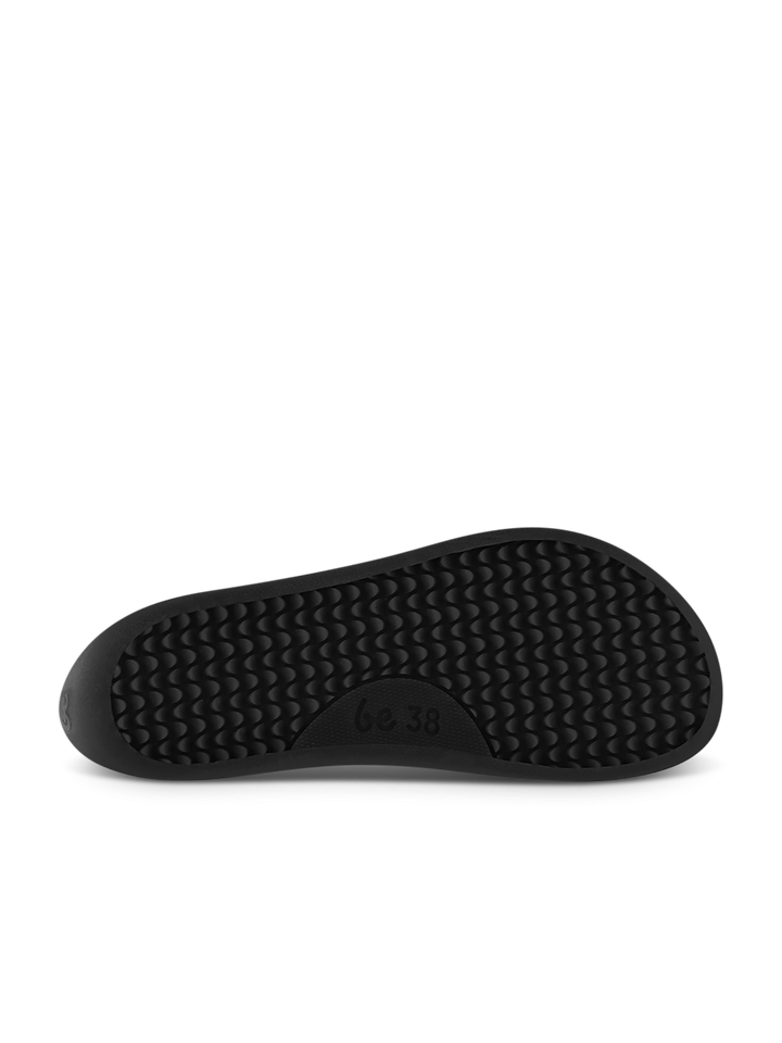 The image shows the bottom view of a black Entice Neo (Unisex) Chelsea boot sole by BeLenka, featuring a textured, wavy grip pattern. The size 38 is visible in the center. The background is plain white.
