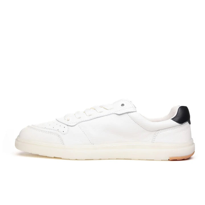 Introducing the BluSun BLSN-600+ (Women’s), a women’s barefoot sneaker crafted from smooth leather. This white low-top shoe features white laces, a cream-colored sole, and a black accent on the heel. Shown in side profile view facing left, its design includes a wide toe box for enhanced comfort.