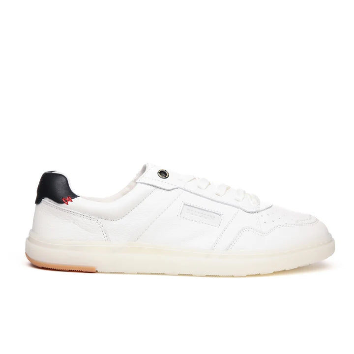Introducing the BluSun BLSN-600+ (Men’s): a white barefoot sneaker designed for men, featuring a low-top silhouette and a wide toe box that promotes natural comfort. The clean look is highlighted by its white sole, matching white laces, and a distinctive black heel accent adorned with a subtle red zigzag detail. Thoughtful stitching and minimalist design make this modern classic stand out.
