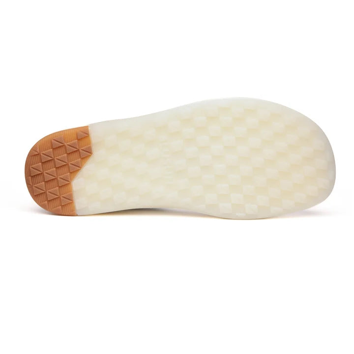 The image displays the sole of the BluSun BLSN-600+ (Men’s) barefoot sneaker, featuring a translucent white surface with a textured grid pattern and a light brown section with raised triangles at the heel. Engineered for natural comfort, this sole delivers sturdy grip and supports ease of movement.
