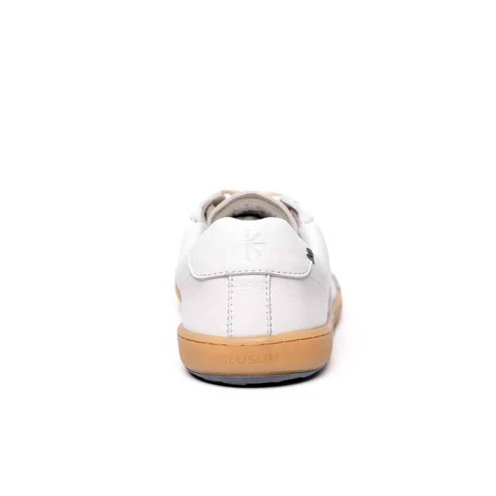 A rear view of the BluSun BLSN-200 men’s sneaker showcases its clean white silhouette, tan rubber sole, and discreet branding on the heel and upper. Made from LWG Gold-certified leather, this minimalist design highlights premium craftsmanship and a sleek aesthetic against a simple white background.