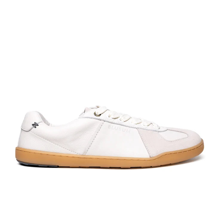 Introducing the BluSun BLSN-200 (Men’s): a minimalist white sneaker made with LWG Gold-certified leather, showcasing a light brown rubber sole, white laces, and barefoot technology. Displayed in a side profile view on a plain white background.
