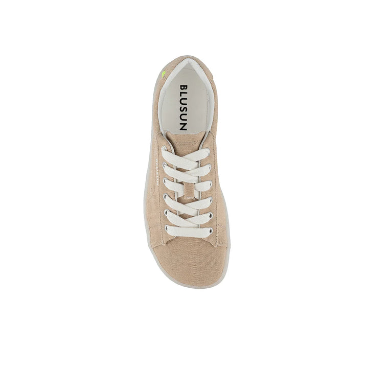 A top view of the BLSN-103 men’s sneaker in beige, featuring white laces and a white sole. The insole displays the BluSun brand name printed in black letters. This barefoot shoe for men is centered on a plain white background.