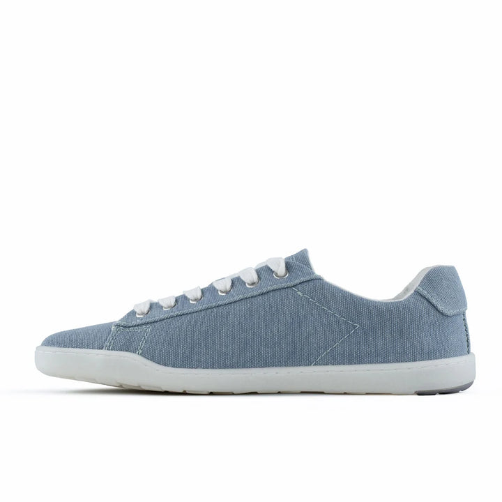 A light blue canvas barefoot shoe, BluSun BLSN-103 (Men’s), featuring white laces and a white sole, is shown in side profile against a plain white background.