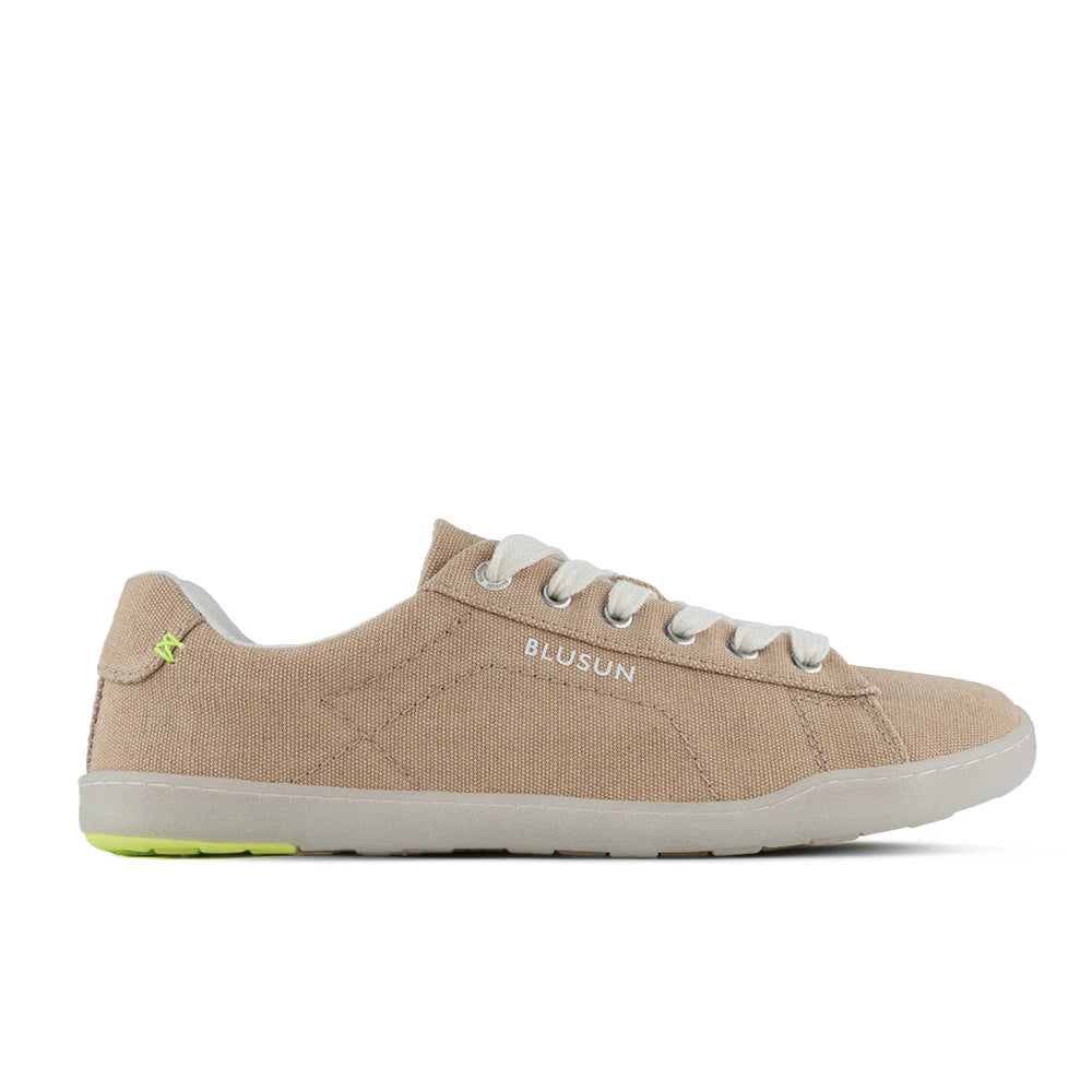 Introducing the BLSN-103 (Men’s) by BluSun—a barefoot shoe crafted from organic cotton in beige canvas, featuring white laces, a white sole, and a subtle pop of neon green on the heel. With the BLUSUN branding on the side, this men’s sneaker showcases a simple and casual design.