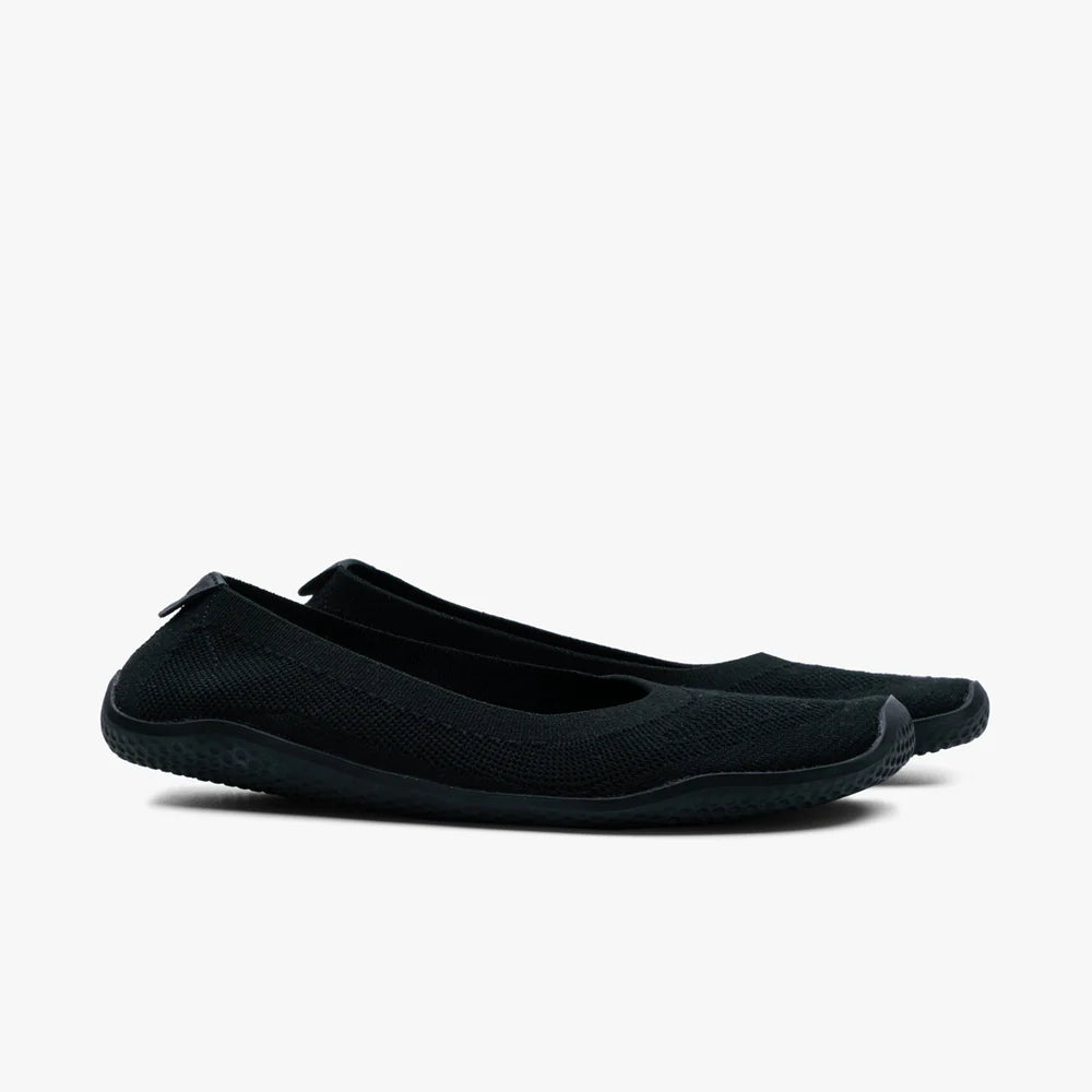 A pair of VIVOBAREFOOT Asana Yin Ballerina Knit slip-on flats for women in black, featuring a textured sole, displayed side by side on a plain white background.