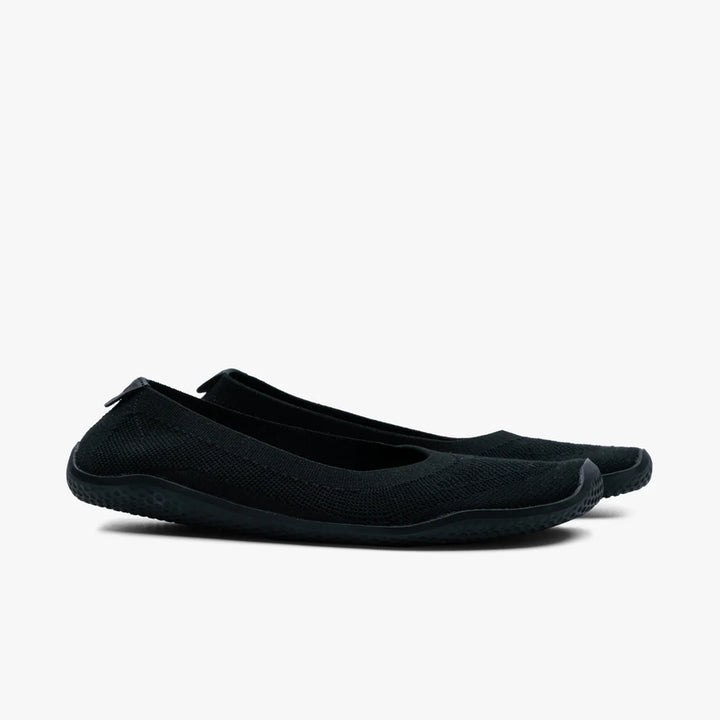 A pair of VIVOBAREFOOT Asana Yin Ballerina Knit slip-on flats for women in black, featuring a textured sole, displayed side by side on a plain white background.